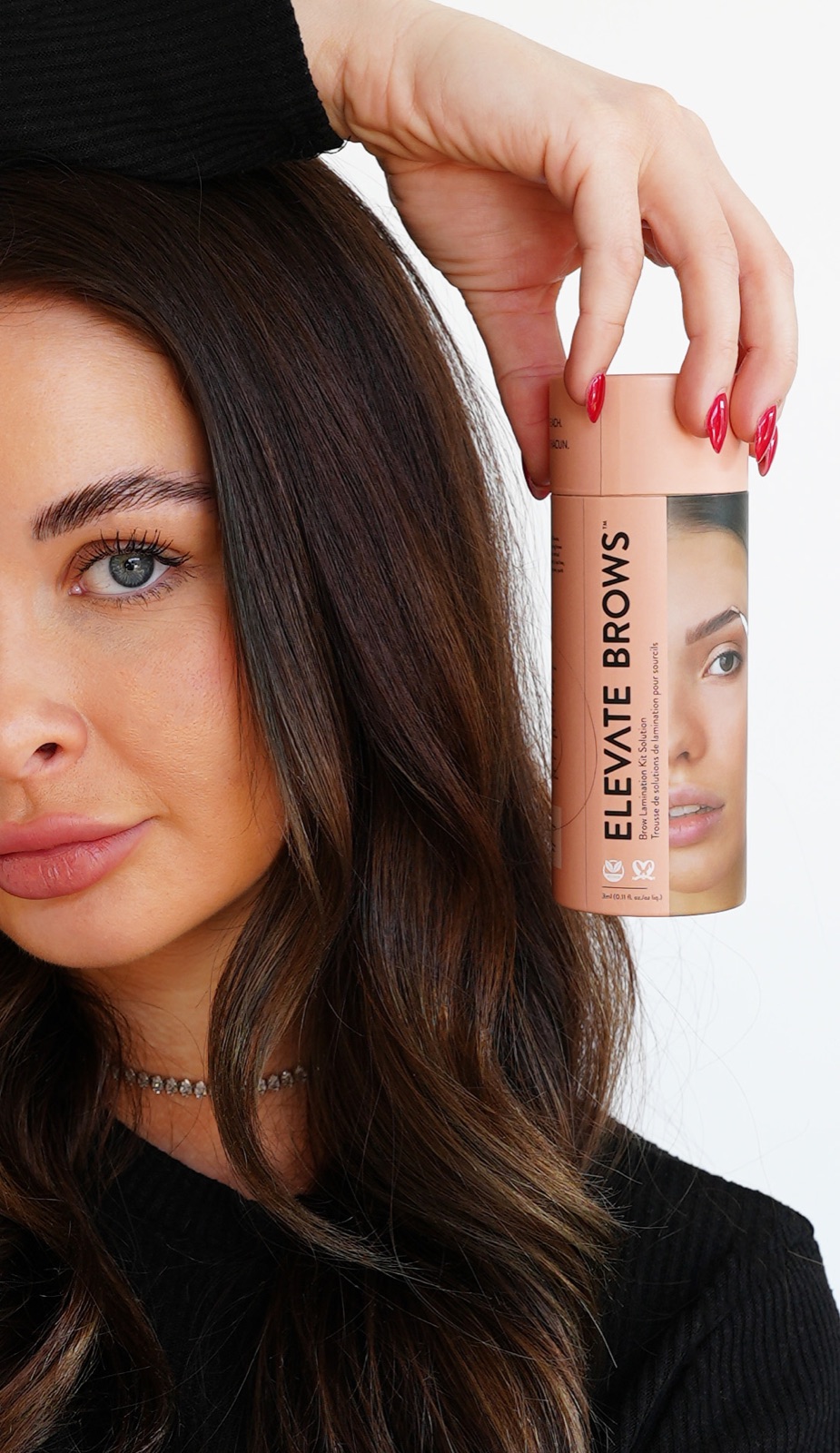 Model holding Lash Artisan Elevate Brows kit