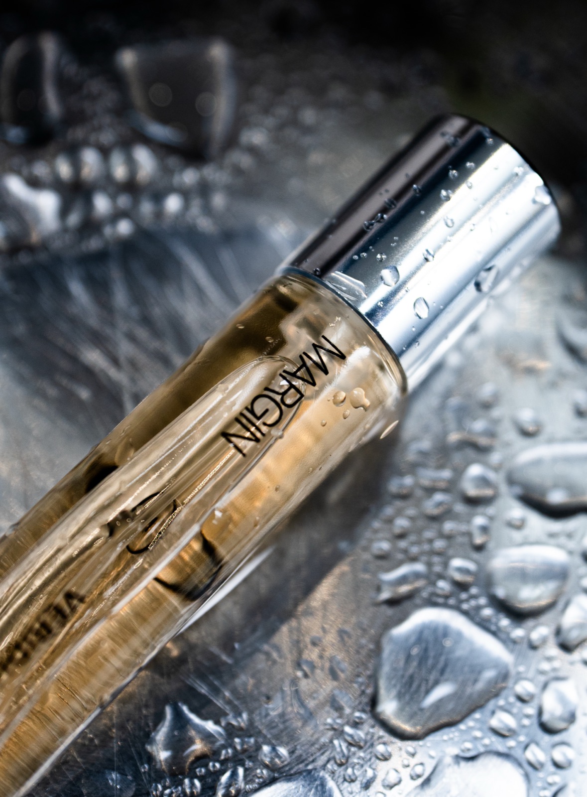 Margin Veridian bottle on perforated brass
