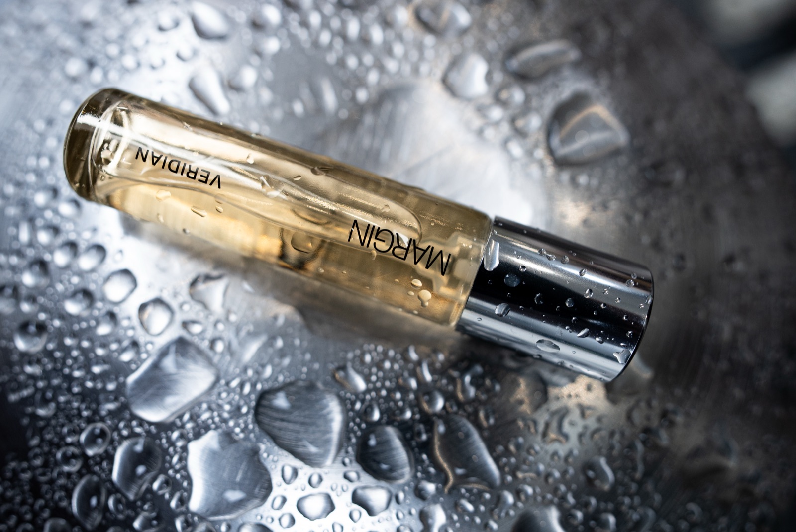 Margin Veridian roller bottle on wet steel